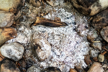 an extinguished fire on the ground