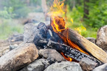 Flames of a fire during the day