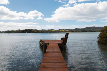 Jetty with view of Pipiroa Bay near Paihia as photographed during a hike in the Bay of Islands (North Island, New Zealand)