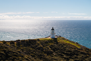 Cape Reinga Lighthouse at the norther most point of Nea Zealand during a sunny summer afternoon (North Island, New Zealand)