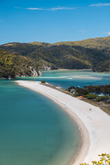 View onto lagoon of Torrent Bay with almost empty white beach during low tide in Abel Tasman National Park (South Island, New Zealand)