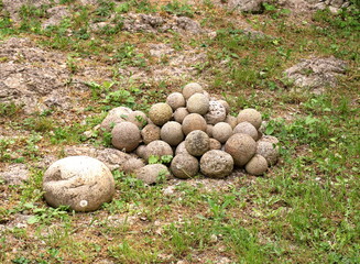 Stone balls on a green meadow