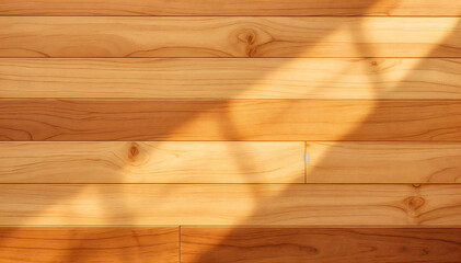 a close-up of a wooden floor with sunlit stripes, showcasing natural textures, grains, and patterns
