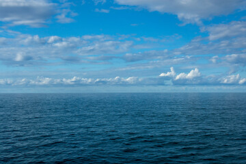 Seascape, white cumulus clouds over the Black Sea, Abkhazia, summer sunny day