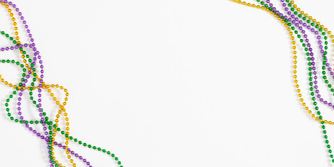 Mardi Gras beads composition background. Festive banner with colorful beads for Mardi Gras...