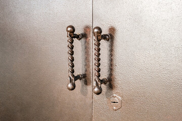 handles on metal painted gates close-up
