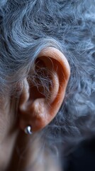 Obraz premium Close-Up of Elderly Woman's Ear Details