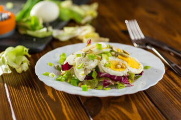 Healthy food on a plate in a plate on a wooden table