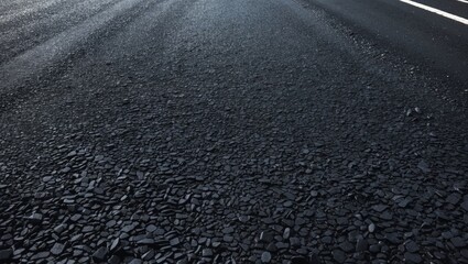 Naklejka premium Sleek black asphalt road texture for background use