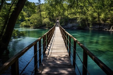 Fototapeta premium Ha Ha Tonka's Natural Spring - Hiking Over Pedestrian Walking Bridge with Clear Blue Water in Missouri Landscape