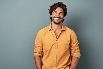 Fototapeta premium Happy Young Casual Man Standing with Arms Crossed. Portrait of Joyful Adult Male in Casual Attire Isolated on White Background