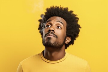 Intolerable Stinky Smell: Afro American Man Holding Breath with Fingers on Nose Isolated on Yellow Background. Bad Smell Concept