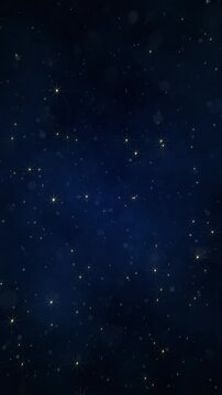 Bright shiny twinkling golden stars in the night sky moving towards the camera. This glittering starry night vertical background is full HD and a seamless loop.