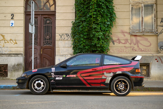 Ivano-Frankivsk, Ukraine - 19 June 2024: black Honda CRX sport compact liftback car rear side view. Style of 80s, 90s.