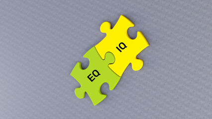Obraz premium EQ and IQ text message on jigsaw puzzle. Gray background and green yellow puzzle