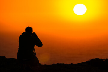 Fototapeta premium Fotografiando la puesta de Sol