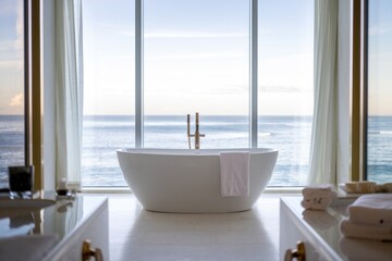 Fototapeta premium Luxury freestanding bathtub with ocean view, offering a tranquil spa-like experience.