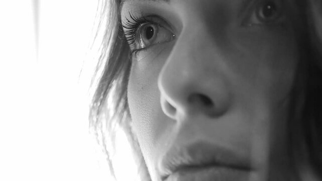 sad and worried woman: black and white extreme closeup potrait