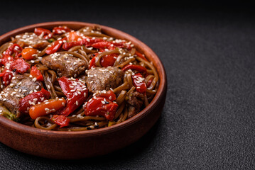 Delicious spicy Asian food soba with buckwheat noodles, beef, vegetables