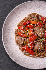 Delicious spicy Asian food soba with buckwheat noodles, beef, vegetables