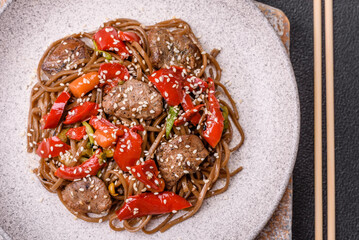 Delicious spicy Asian food soba with buckwheat noodles, beef, vegetables