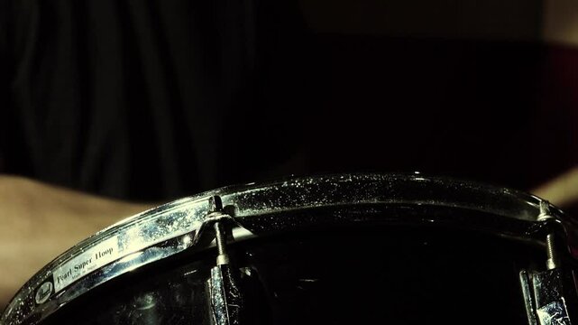 playing A tom-tom drum