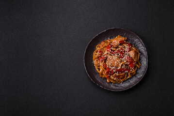 Delicious Asian food udon with noodles, chicken, hot pepper, vegetables