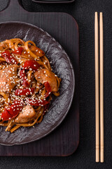 Delicious Asian food udon with noodles, chicken, hot pepper, vegetables