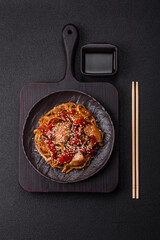 Delicious Asian food udon with noodles, chicken, hot pepper, vegetables