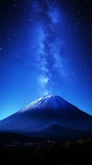 Fototapeta premium Majestic mountain peak under a vibrant, starry night sky.