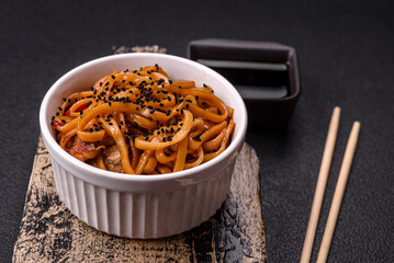 Delicious Asian food udon with noodles, chicken, hot pepper, vegetables