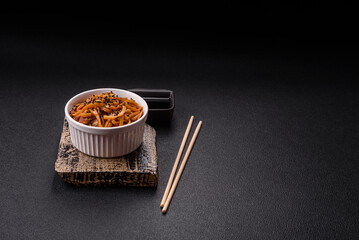 Delicious Asian food udon with noodles, chicken, hot pepper, vegetables