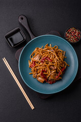 Delicious Asian food udon with noodles, chicken, hot pepper, vegetables
