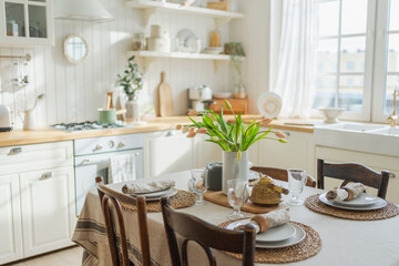 Scandinavian classic minimalistic kitchen with white and wooden details flowers. Modern white kitchen clean contemporary style interior design. Empty bright white interior minimal of kitchen