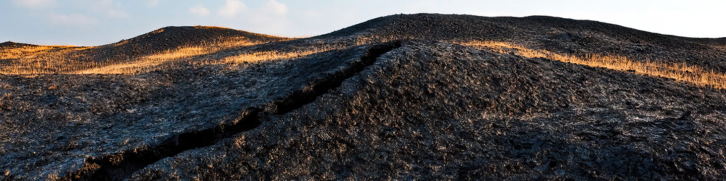 Dark Hills with Fissure and Dried Grass