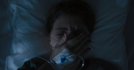 Female patient yawns while recovers after bad accident.
