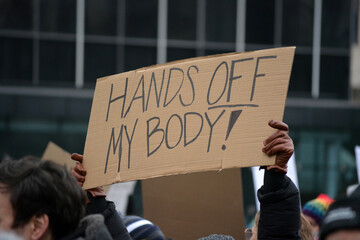 Person holding a sign at the 2025 People's March in New York City.