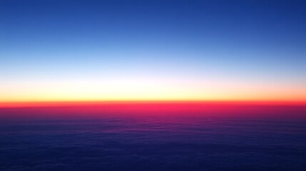 Aerial View of a Vibrant Sunset Over Clouds