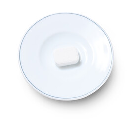 White dishwasher tablet on plate