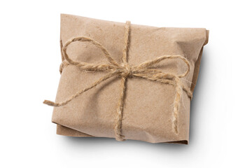 A small gift wrapped in wrapping paper and tied with twine