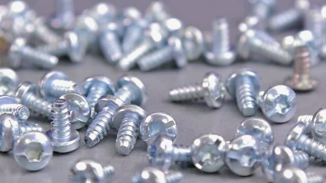 Metal screws for fastening equipment. Soft focus. Close-up. 