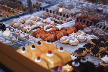 Delicious pastries displayed in showcase