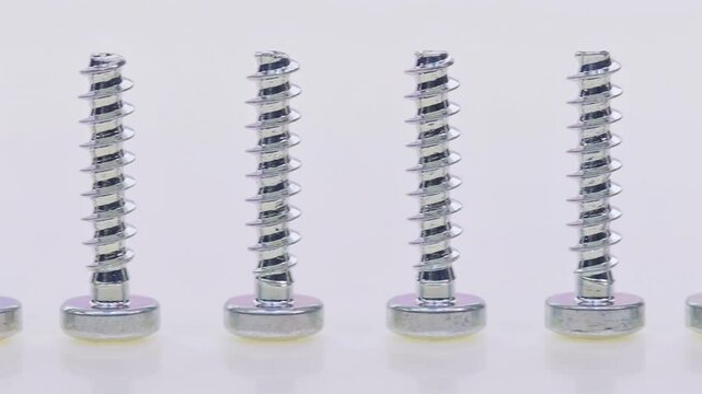 Metal screws for fastening equipment. Soft focus. Close-up. 