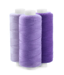 Spools of colorful sewing threads isolated on white