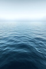 Obraz premium Calm ocean surface with fog.