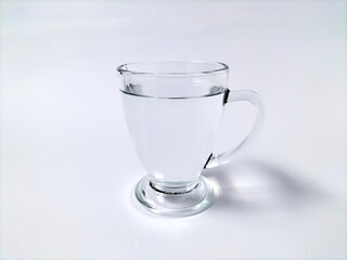 Glass with water on a white background