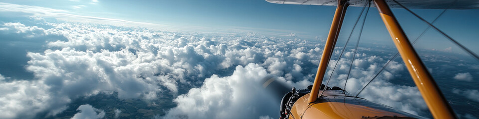 Fototapeta premium Biplane Flight Over Cumulus Cloudscape