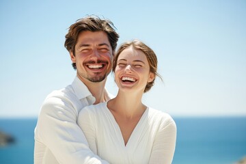 Obraz premium A joyful couple sharing laughter and love near the ocean at sunset