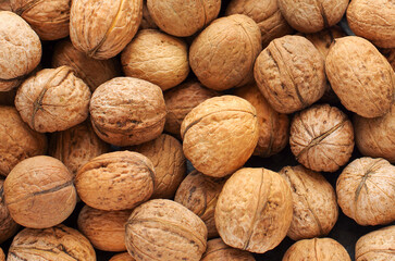 Top view of whole walnuts as background texture
