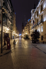 Naklejka premium Illuminated street leading to oviedo cathedral at night, spain